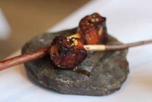 Pork belly with spices on a stick