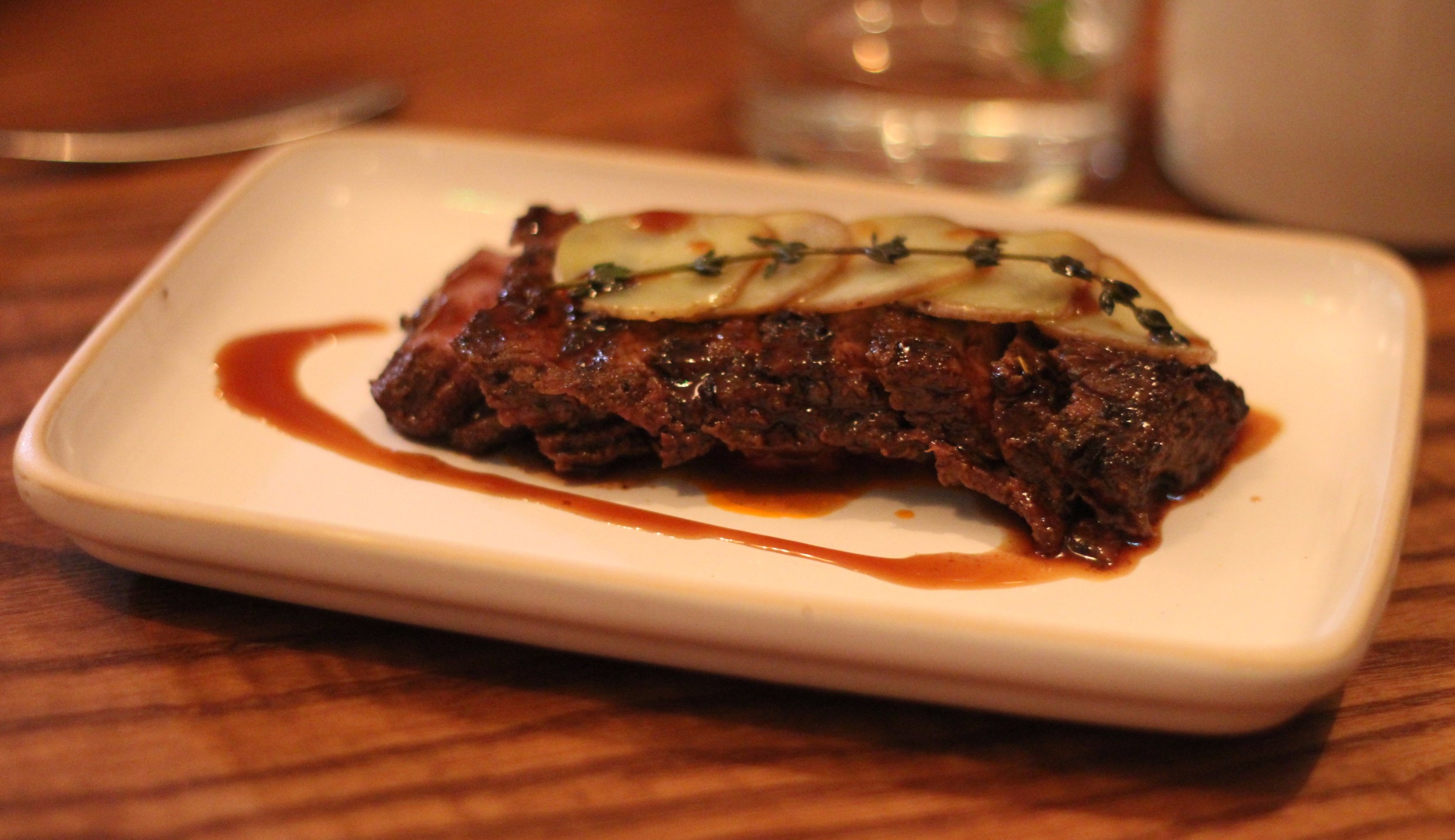 marinated beef with garlic, potatoes and slow roasted peppers