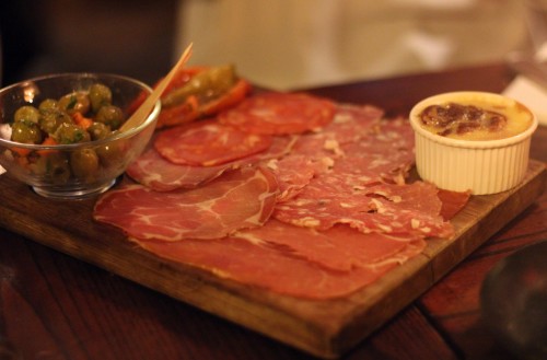 Lovely selection of cold meat from SouthWest France and homemade Chicken liver parfait, confit sweet peppers and olives