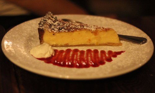 Home made lemon tart served with crème fraiche and raspberry coulis