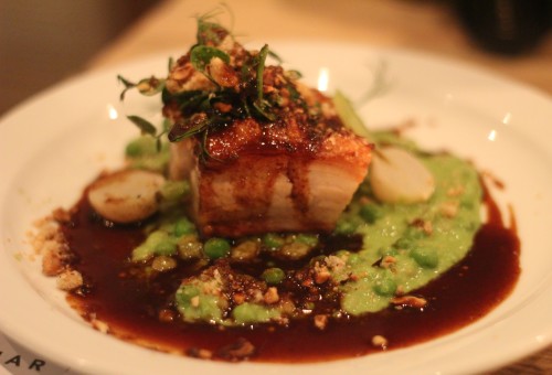 Pork belly, peas, lentils, baby turnips, scratching and hazelnut crumble