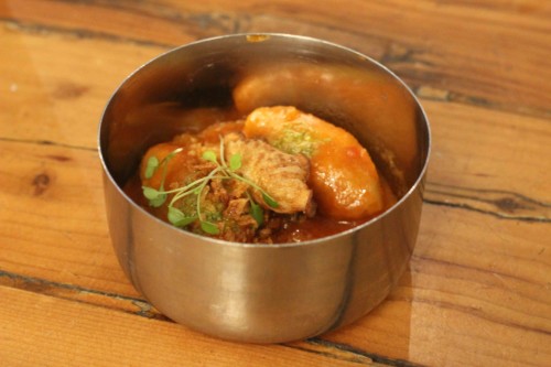 Kubba hamuth - lamb dumplings, tomato sauce, turnips, onions, garlic & mint oil