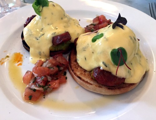 Poached eggs on English muffin - Huevos Benedictos, chorizo, avocado, béarnaise sauce, pico de gallo