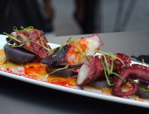 Pulpo - Pan-roasted whole octopus tentacle, purple potatoes, paprika, olive oil