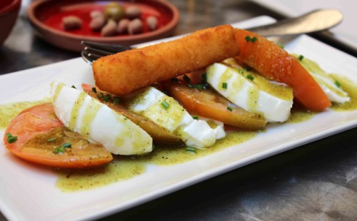 Tomato and mozzerella salad with hazelnut pesto and polenta stick