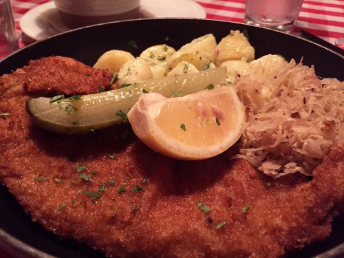Bodo’s Veal Wiener Schnitzel Served with Sauerkraut traditional Austrian potato salad pickle and lemon 2