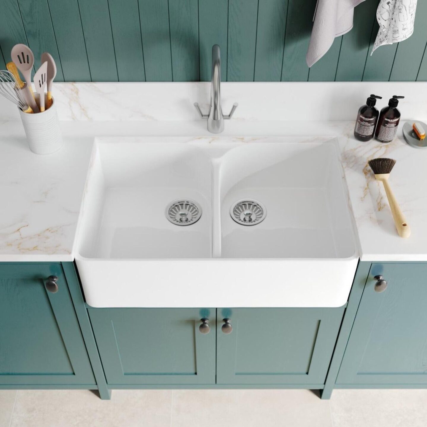 A sink with a faucet and a white counter top